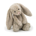 Beige Jellycat bunny soft toy against white background.