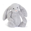 Grey Jellycat bunny soft toy against white background.