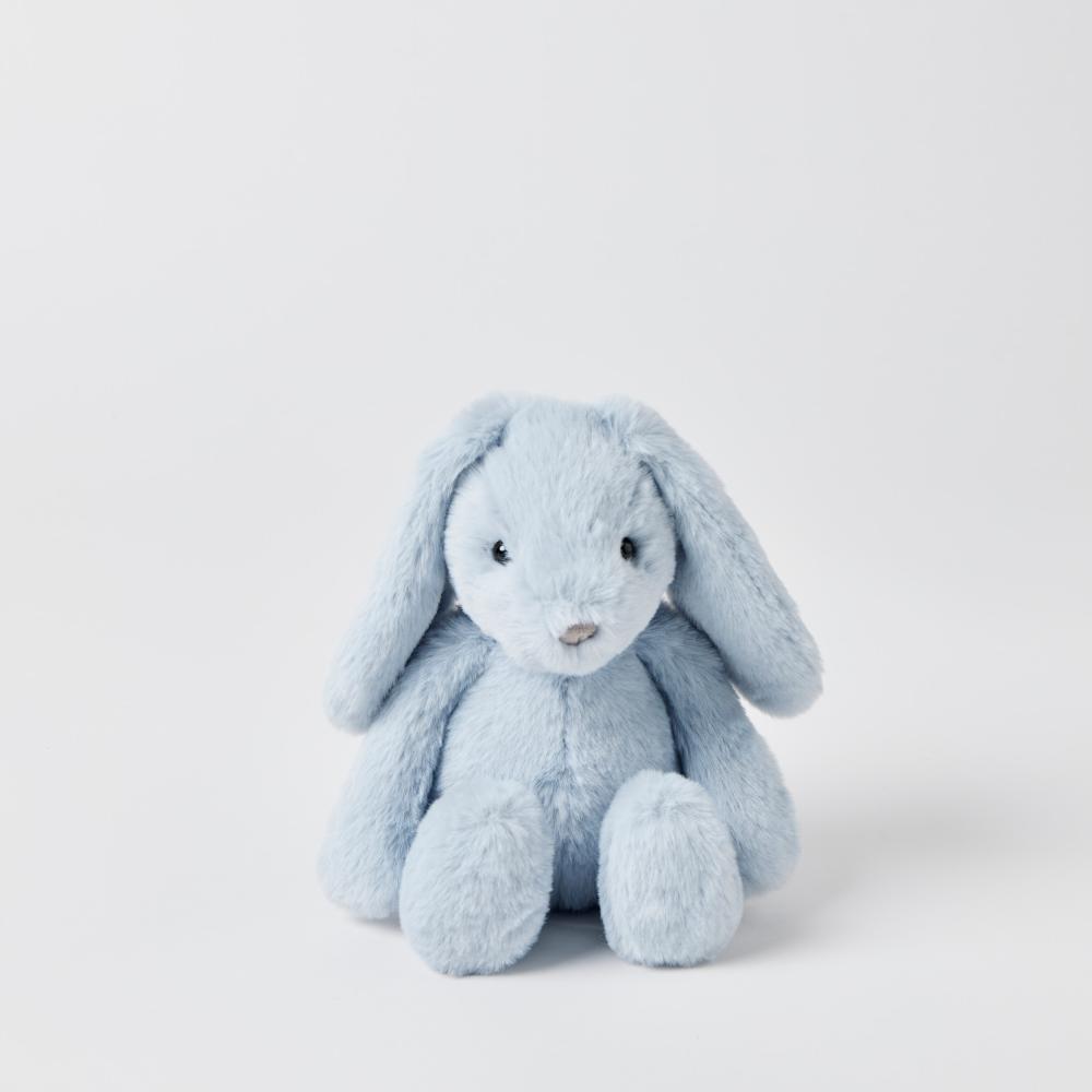 Blue plush bunny toy on a light gray background