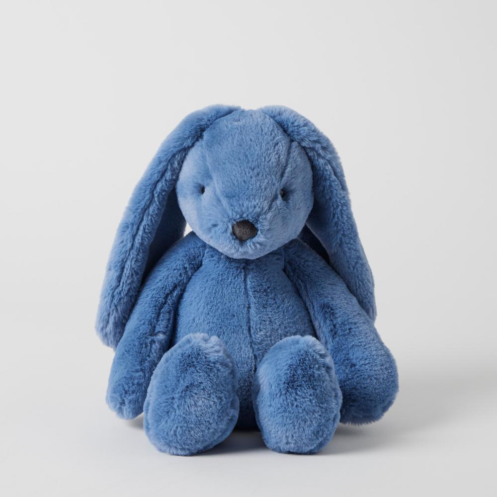 Blue plush bunny toy on a light gray background