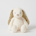 White plush bunny with floral ears on a white background