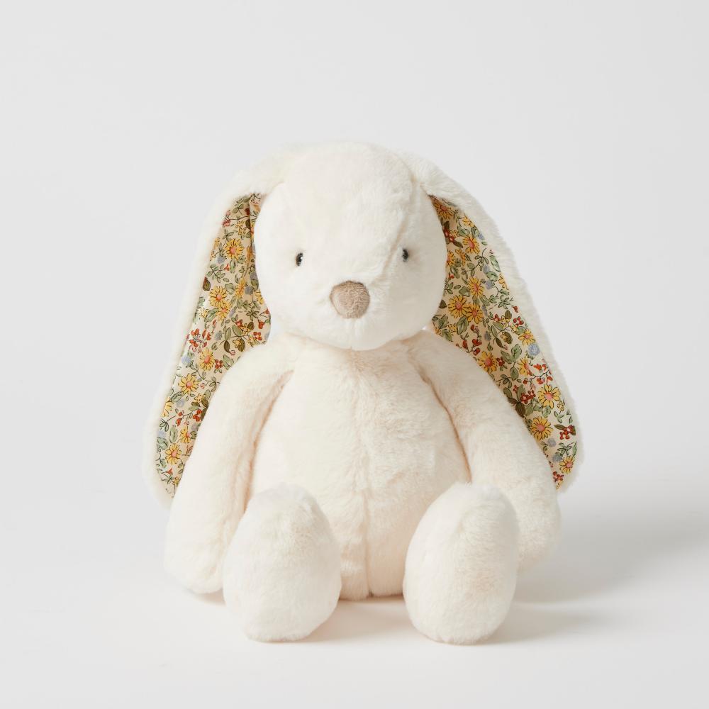 White plush bunny with floral ears on a white background
