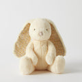 Yellow Plush toy rabbit with floral ears on a white background