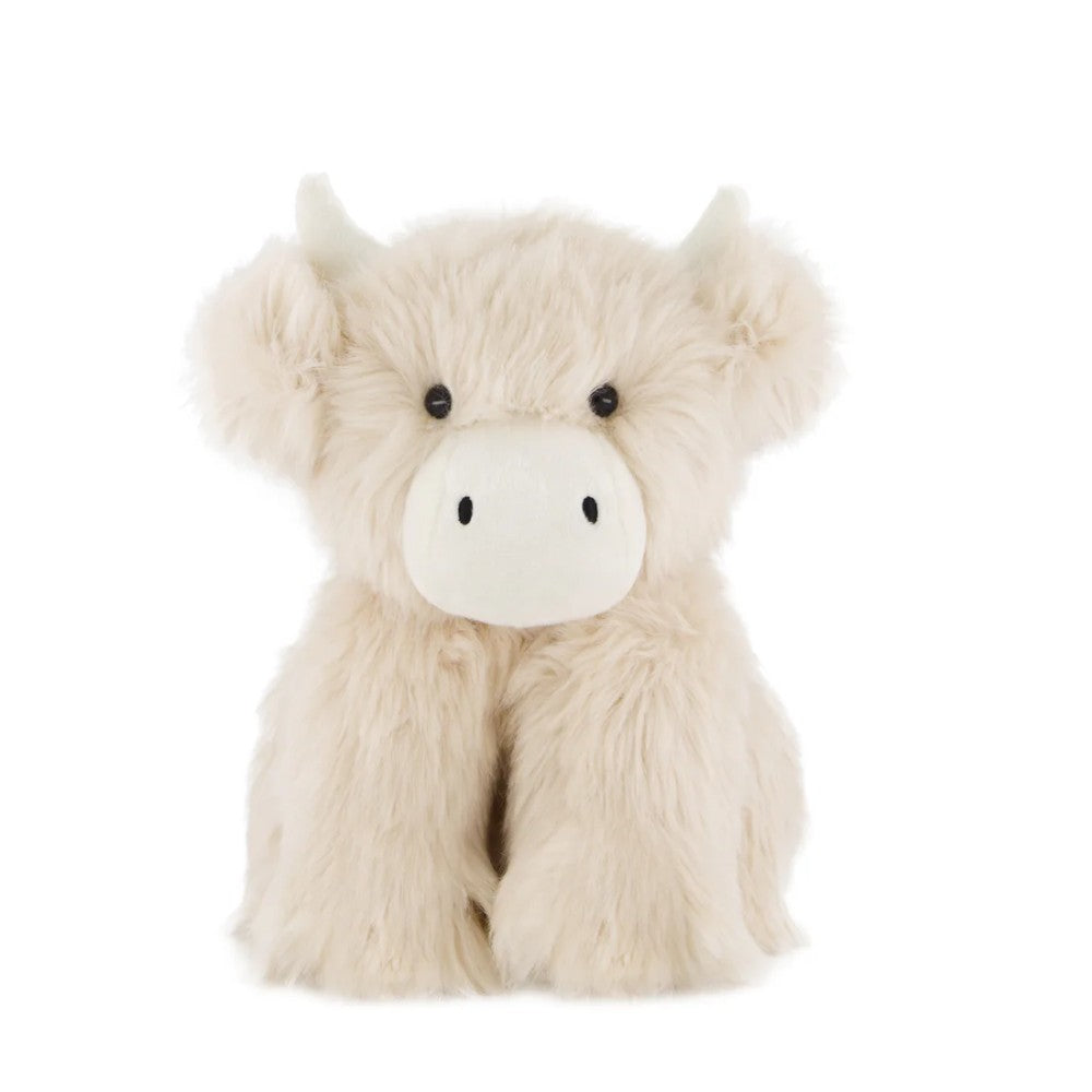 Cream Jamie Kay cow soft toy against white background.