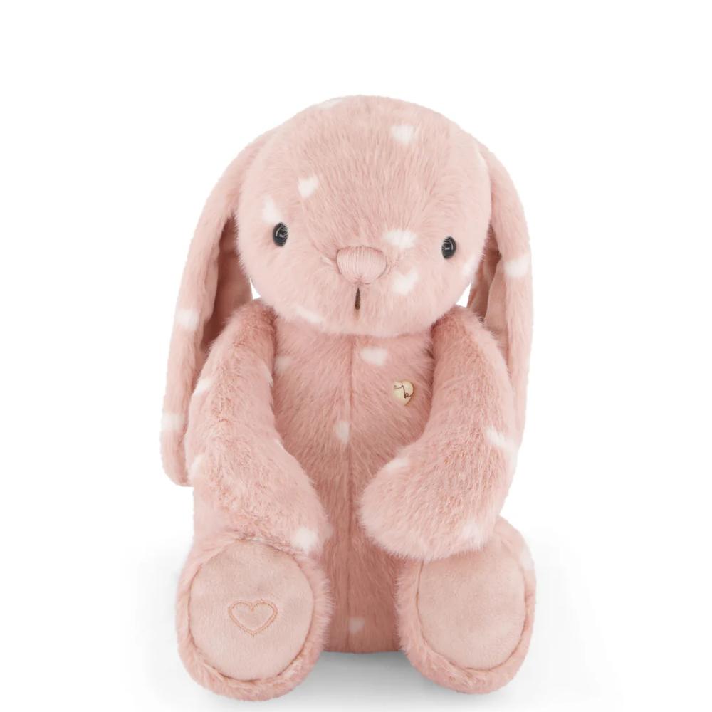 Pink Jamie Kay bunny soft toy with white hearts against white background.