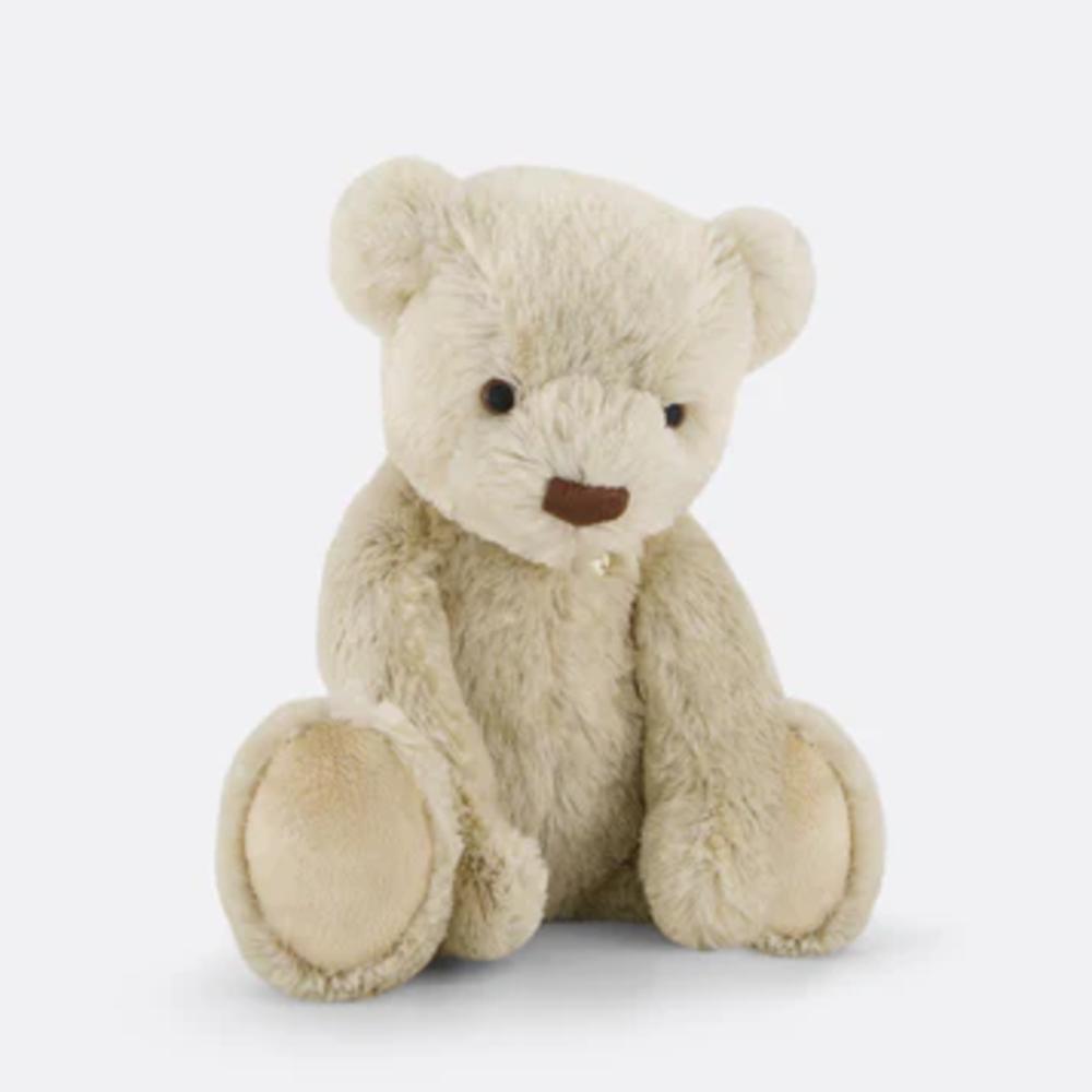Beige plush Jamie Kay teddy bear sitting against white background.
