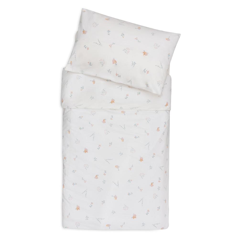 A folded bedding set featuring a duvet cover and matching pillowcase, both in white with a delicate, small-scale pastel pattern of flowers