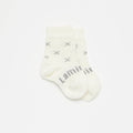Whie baby socks with X on a white background