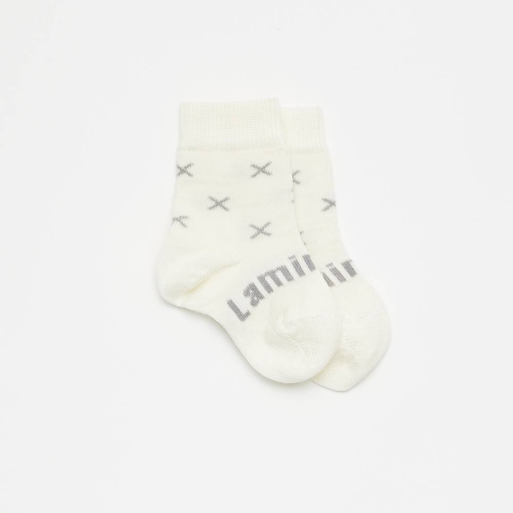 Whie baby socks with X on a white background