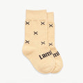 Merino baby crew socks, beige with dark brown crosses on a white background. 