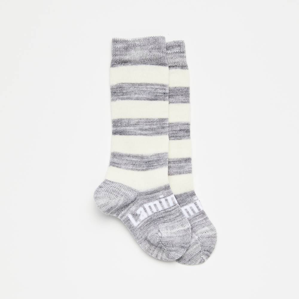 Grey and white knee high socks on a white background