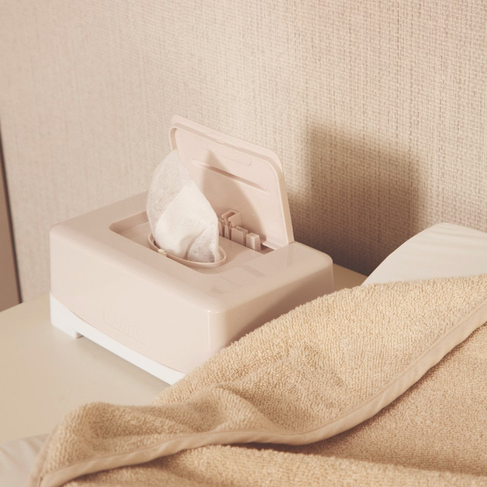 An open Pure Oat LUMA Wipes Box on a dressing station.