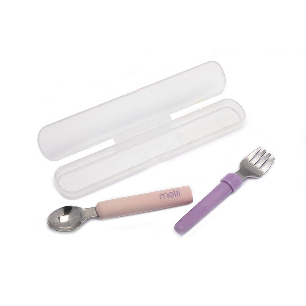 Set of pink spoon and purple fork with white case on a white background