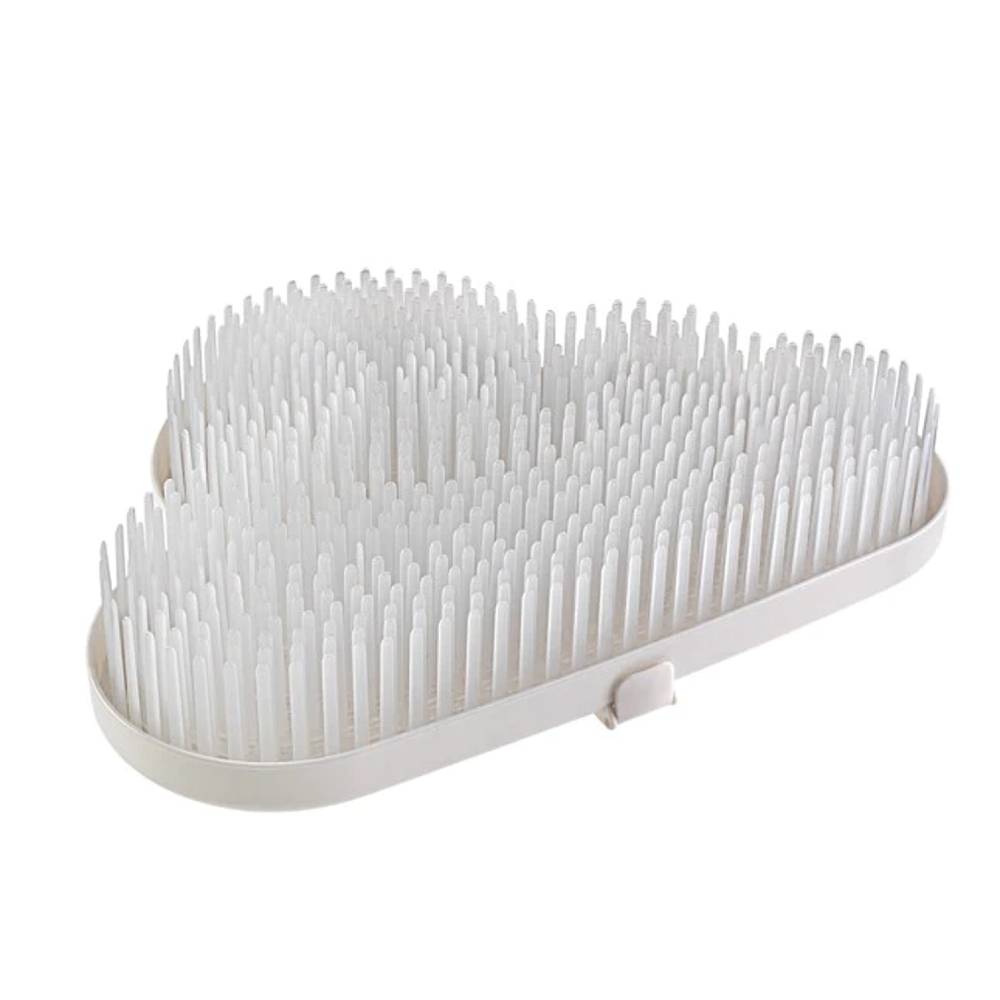 White baby drying rack and draining board with bristles on a white background