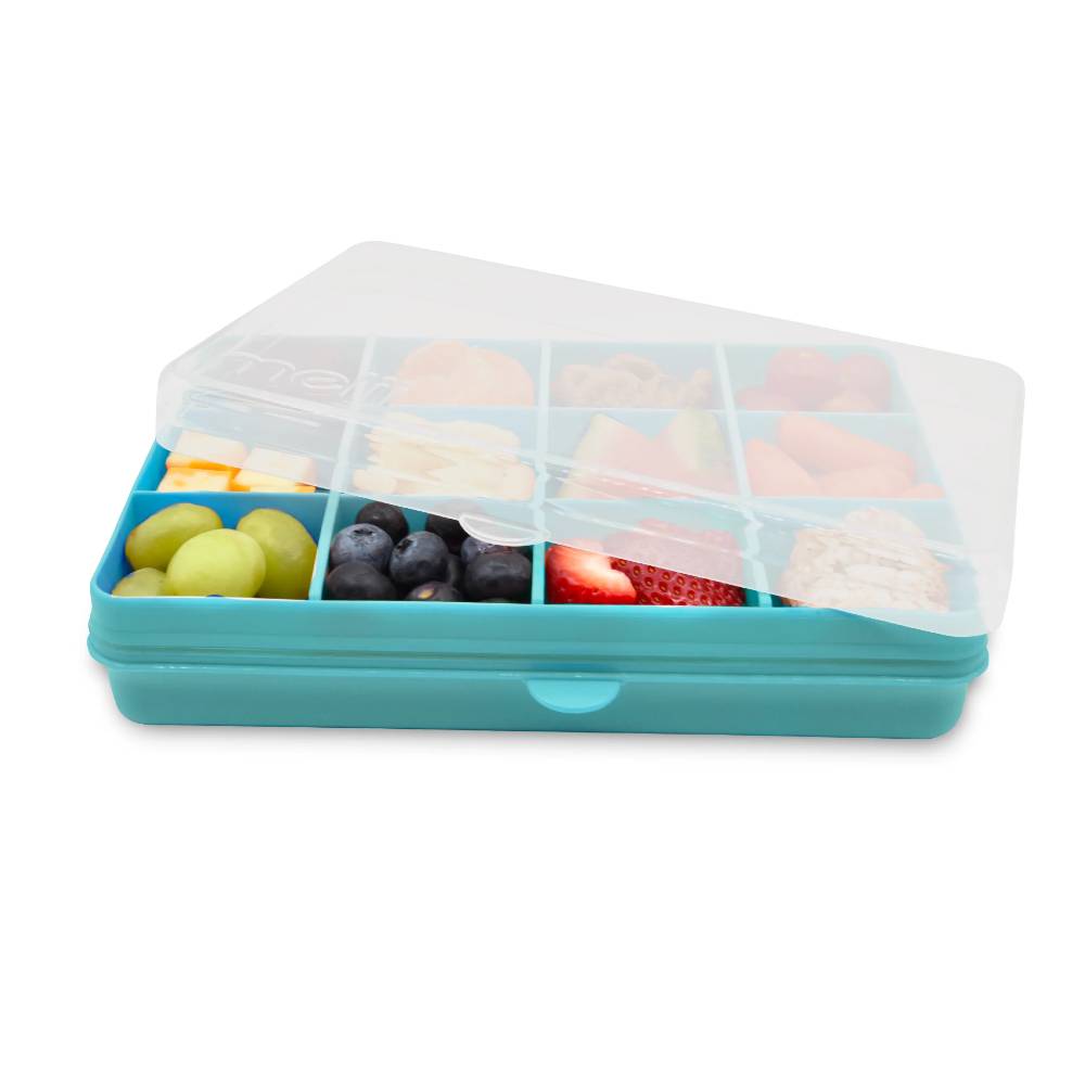 Teal Melii snack container with compartments filled with fruits on a white background