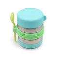 Insulated food jar for children with a lid and spoon on a white background