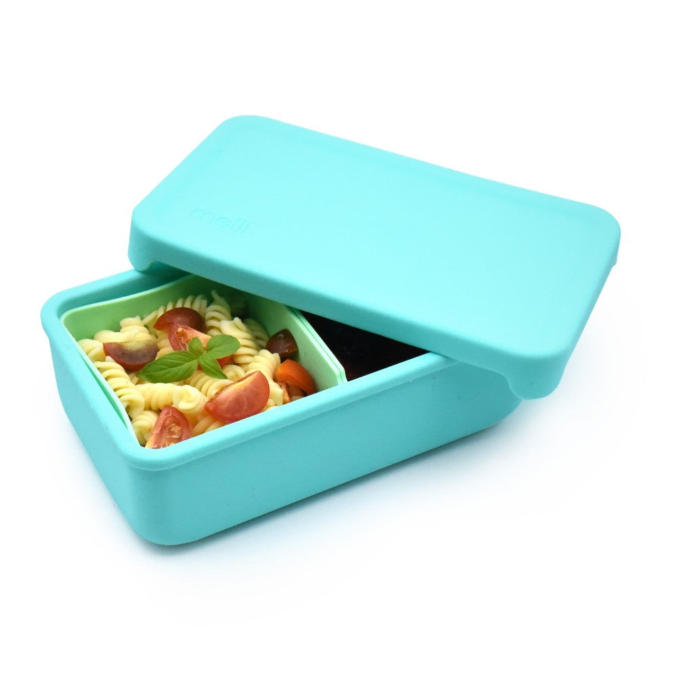 Turquoise silicone bento lunch box with pasta salad inside on a white background