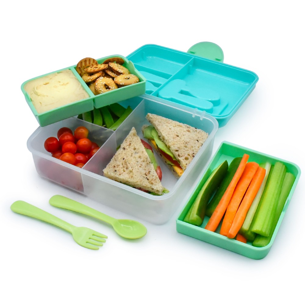 Green and white Melii bento box with compartments filled with snacks and a sandwich, on a white background.