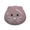 Pink cat-shaped snack pot with black eyes and white whiskers on a white background