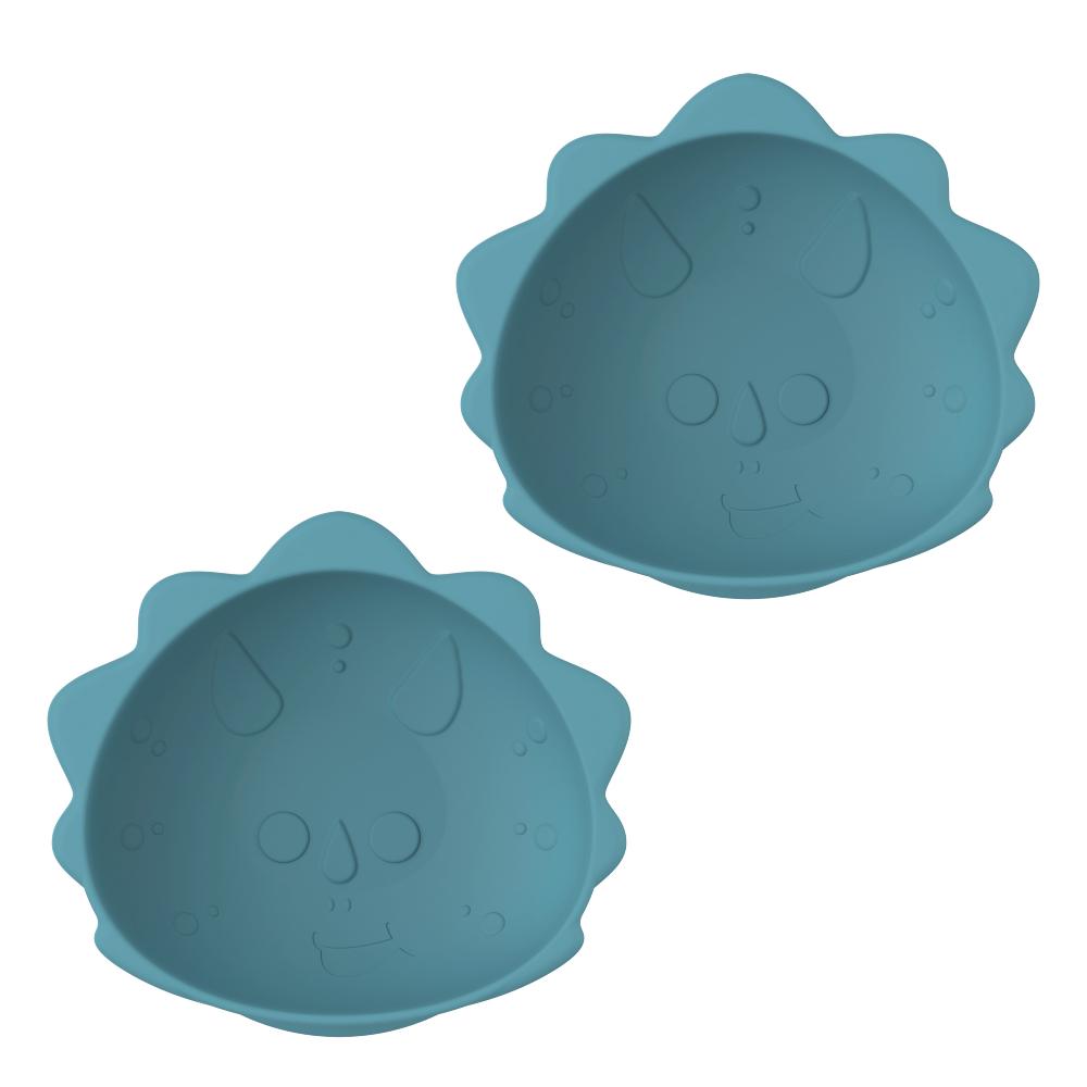 Two blue dinosaur suction silicone bowls with textured surface on a white background