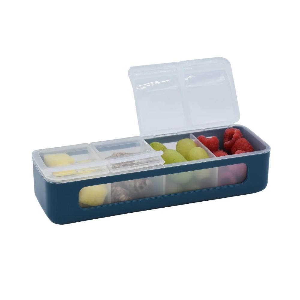 Blue snack container with compartments filled with fruits and snacks on a white background