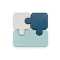 bento Box in puzzle piece design in blue, white, and light blue on a white background