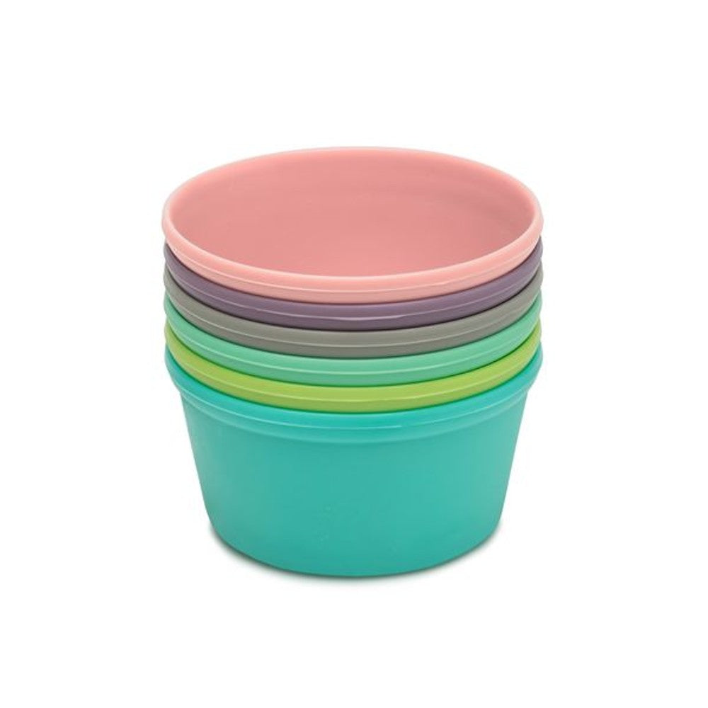 Stack of colorful silicone baking cups on a white background