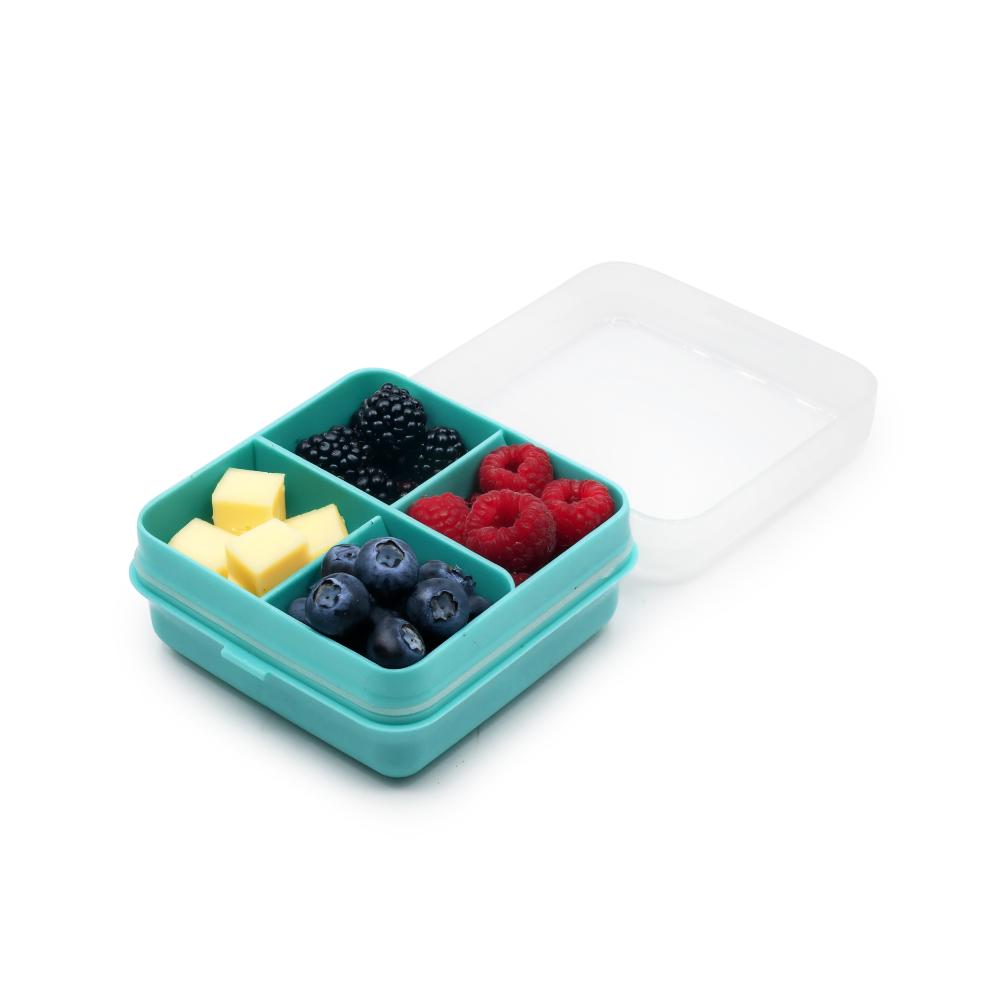 Teal compartmentalized snackle snack container with fruits and cheese on a white background