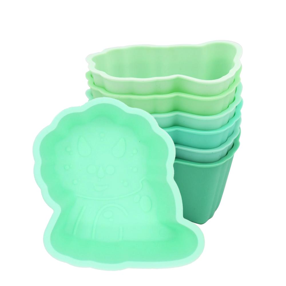 Set of green silicone food cups on a white background
