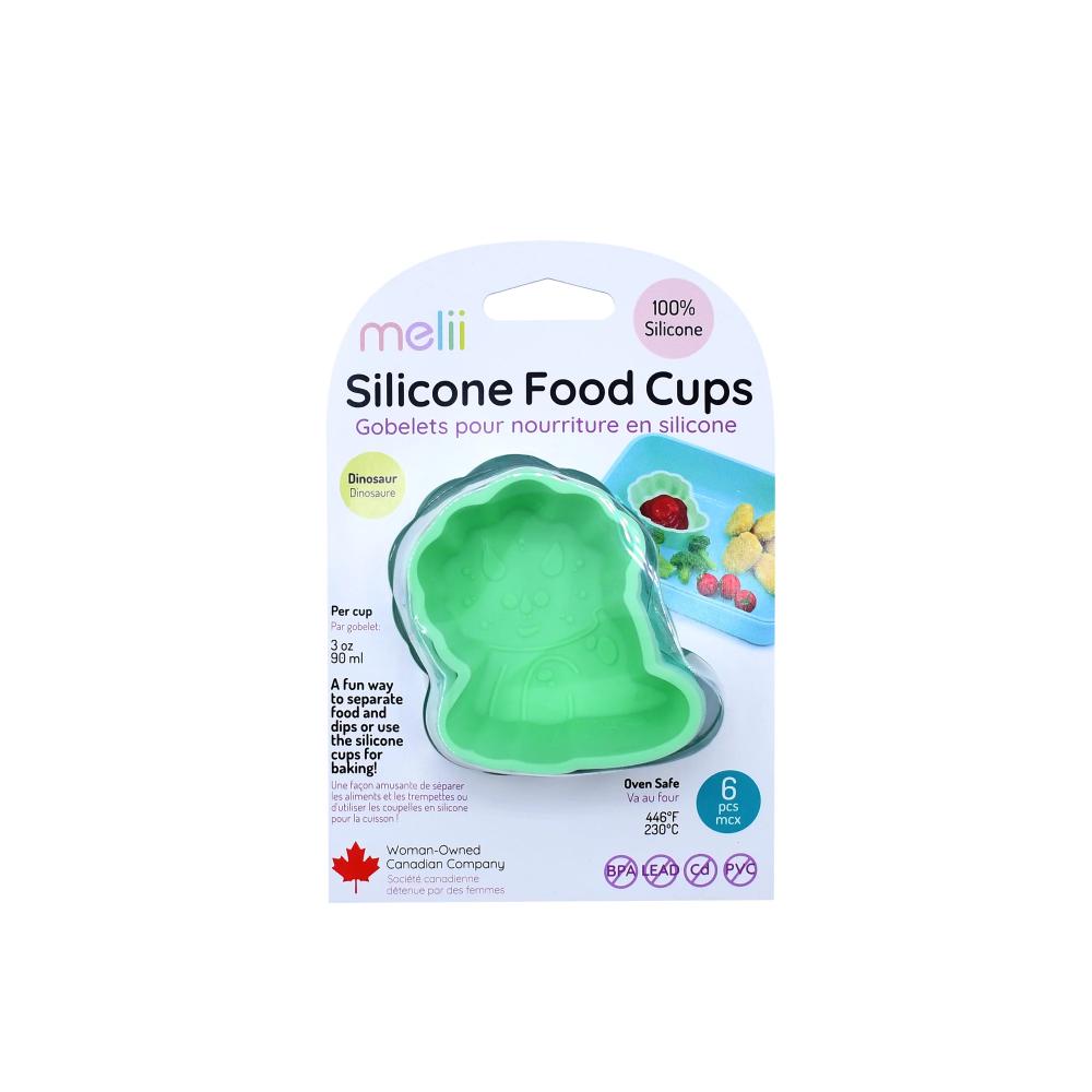 Packaging of  dinosaur shaped silicone food cups with green silicone mold on a white background