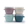 Four snack cups with lids stacked on a white background, branded 'melii'.
