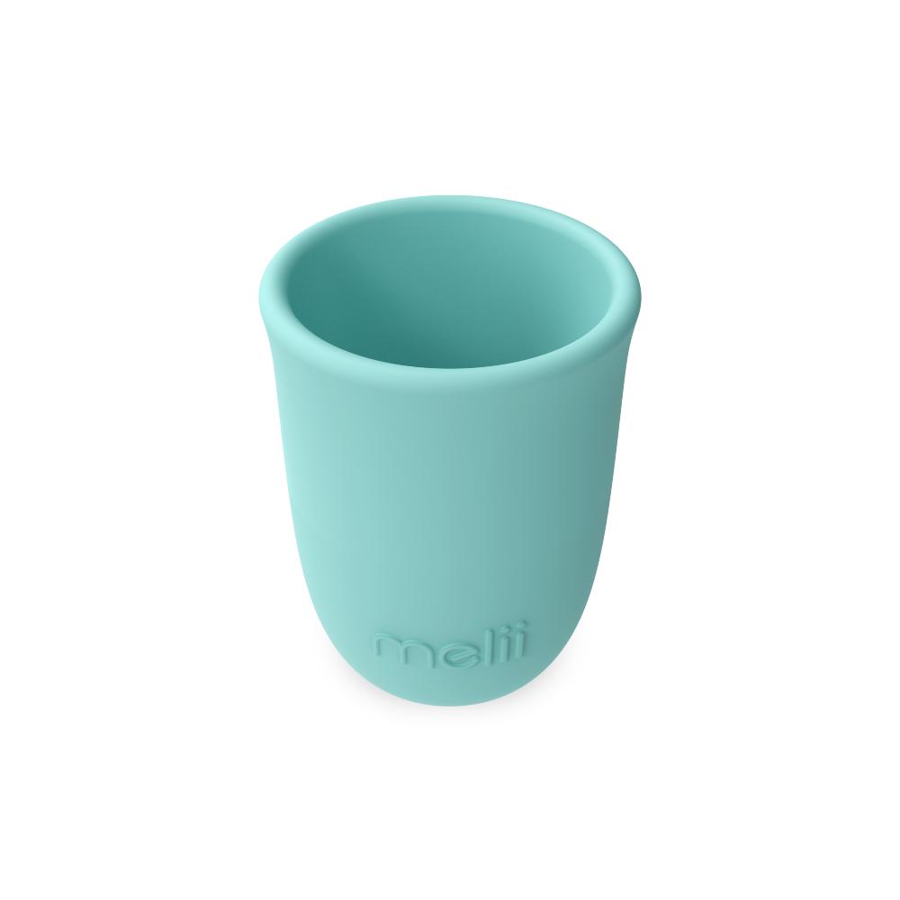 Turquoise silicone cup with 'mali' branding on a white background