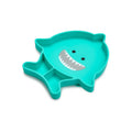 Teal shark-shaped plate with a smiling face on a white background