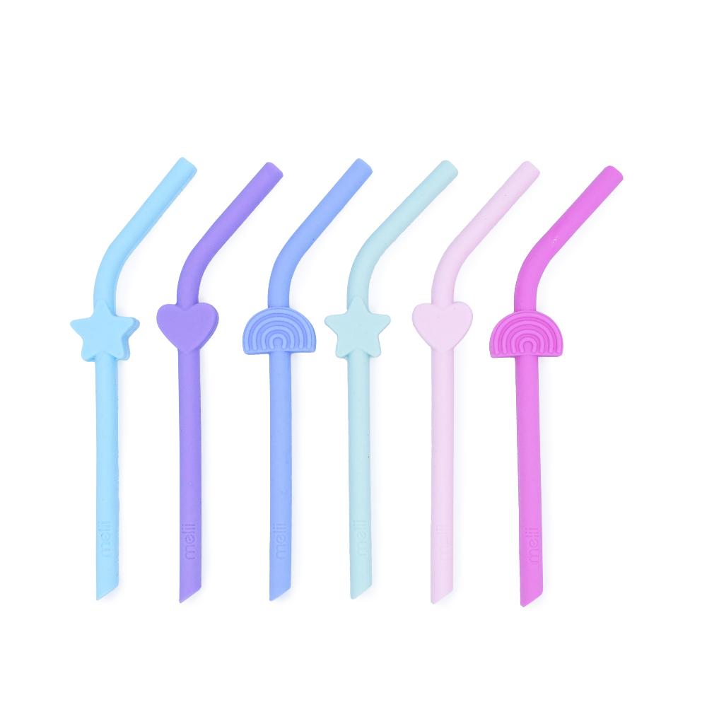Set of six colorful silicone straws with decorative ends on a white background