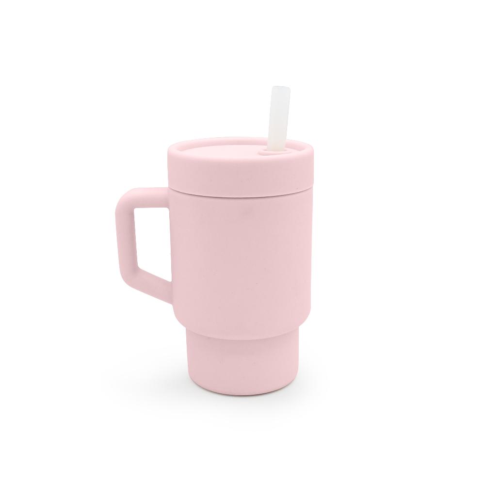 Pink silicone kids trainer mug with handle and straw on a white background