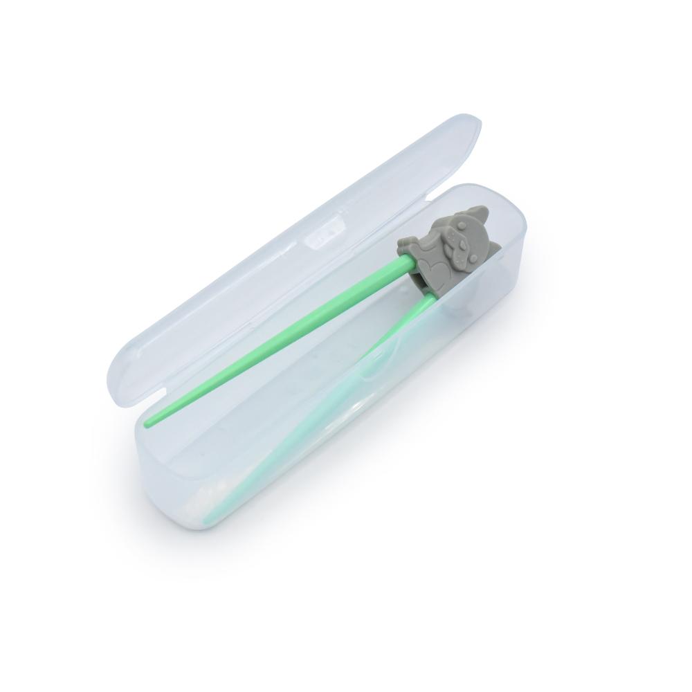 Children's green chopstick trainer with gray handle in a clear case on a white background