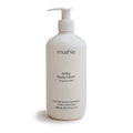 White bottle of mushie baby body lotion on a white background