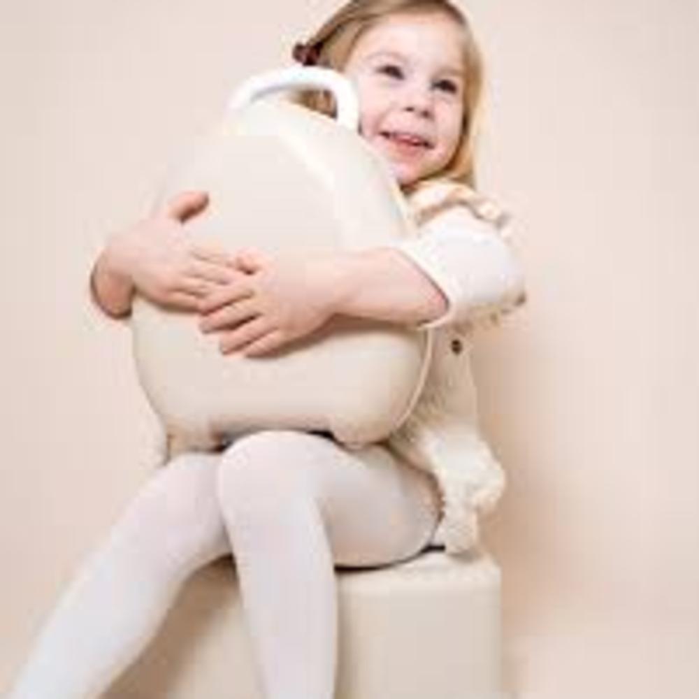 Child holding My Carry Potty against white background.