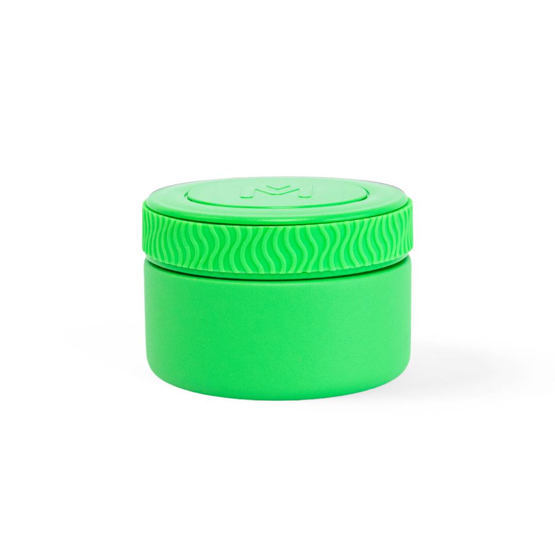 Green container with lid on a white background