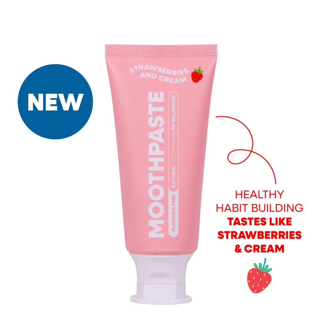 Pink toothpaste tube with strawberry and cream flavor on a white background