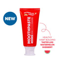 A red squeeze tube of Moothpaste Watermelon Sherbet toothpaste on a white background.