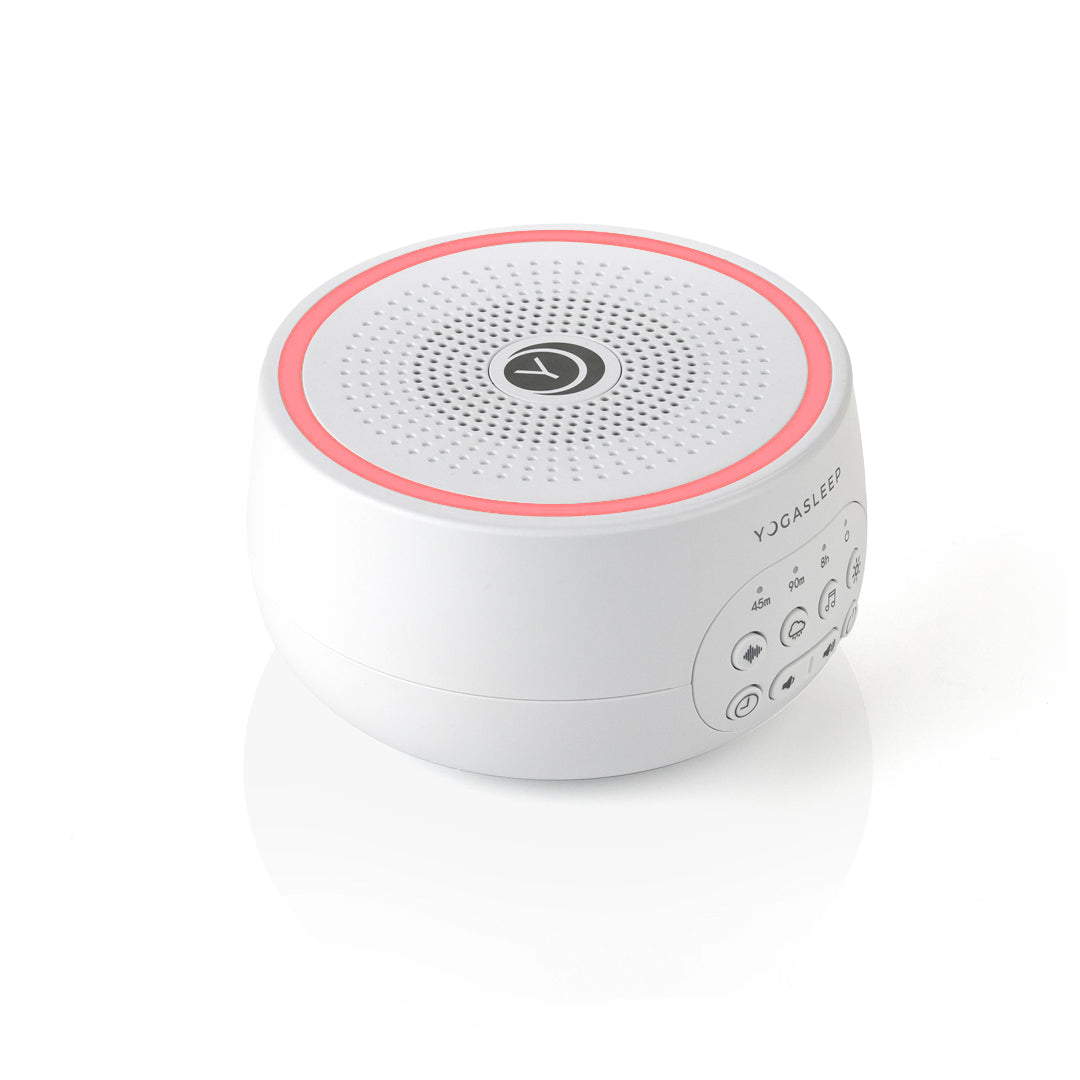 White white noise machine with pink light and control buttons on a white background