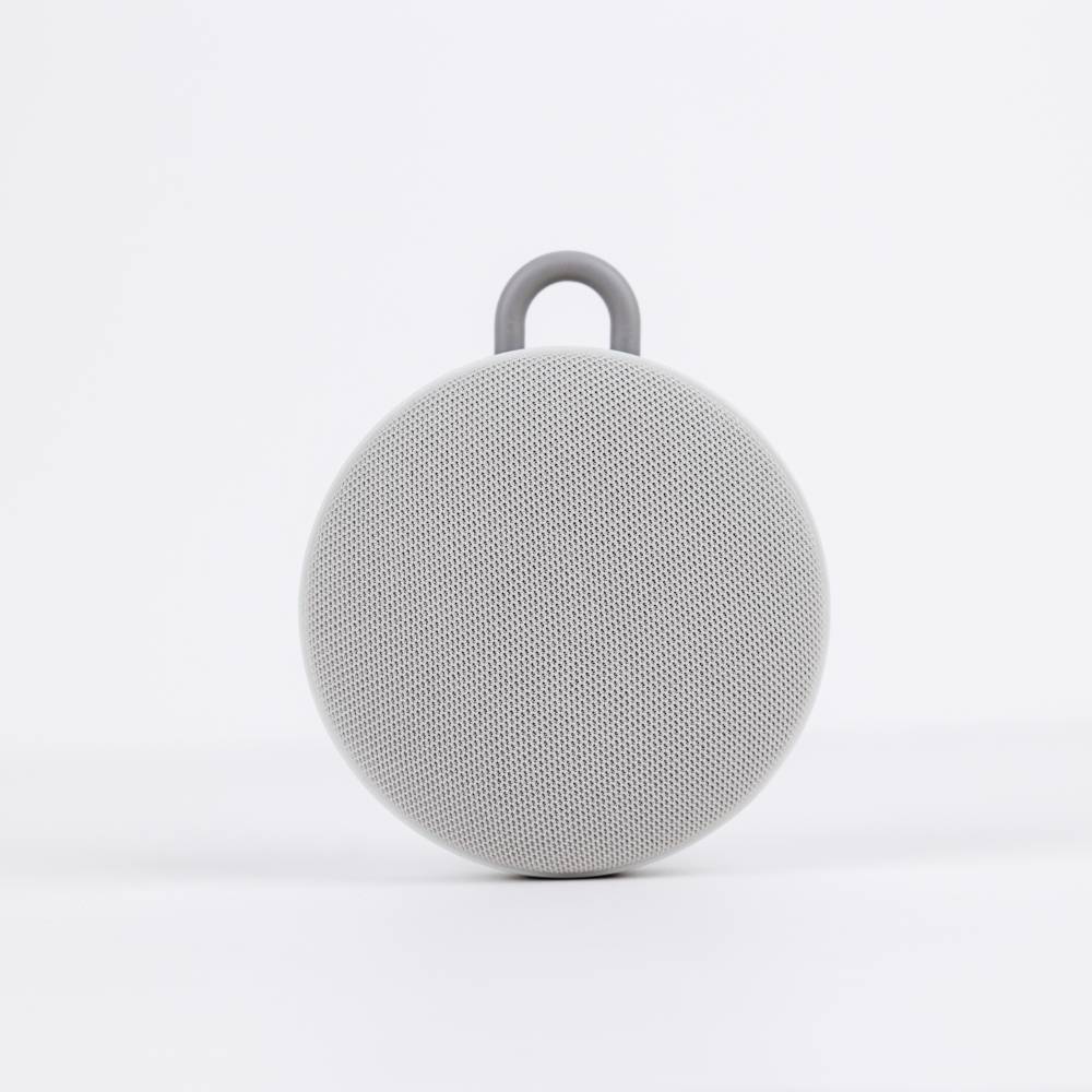 Gray portable white noise machine on a white background