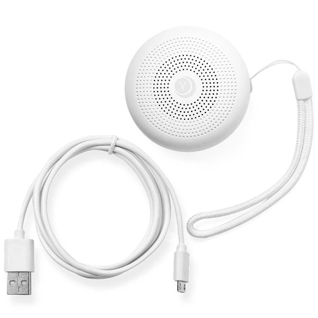 Yogasleep Travel Mini white noise machine with USB cable on a white background
