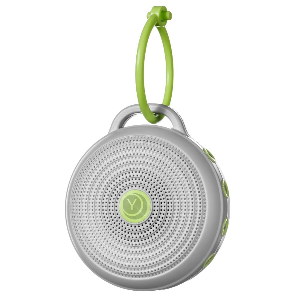 Portable white noise machine with a green handle on a white background