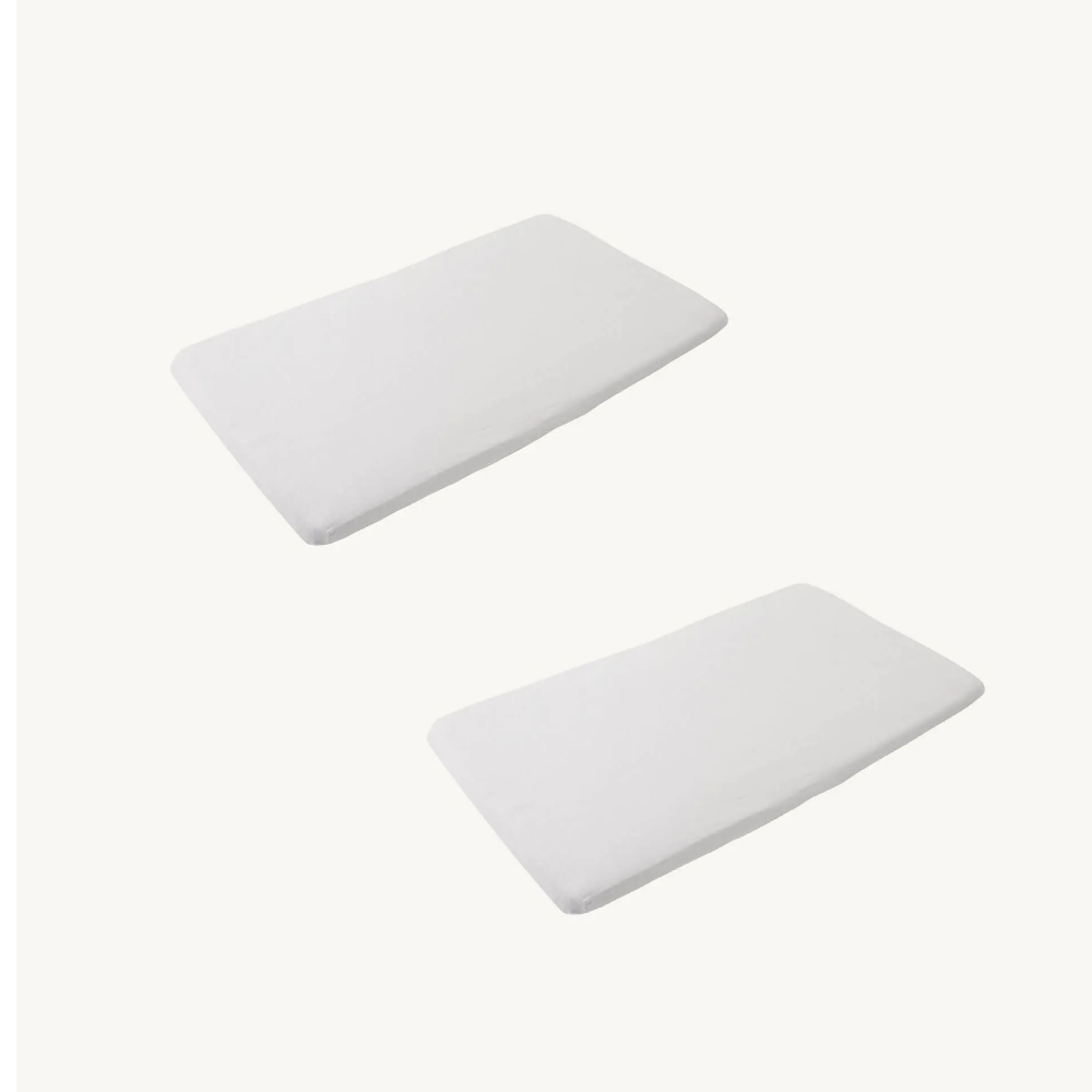 Two rectangular white mattresses with rounded corners and white sheets, shown on a plain off-white background.