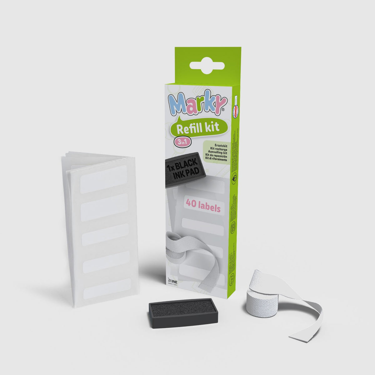 DIY Marky refill kit with packaging, ink pad, and labels on a white background for clothing labels