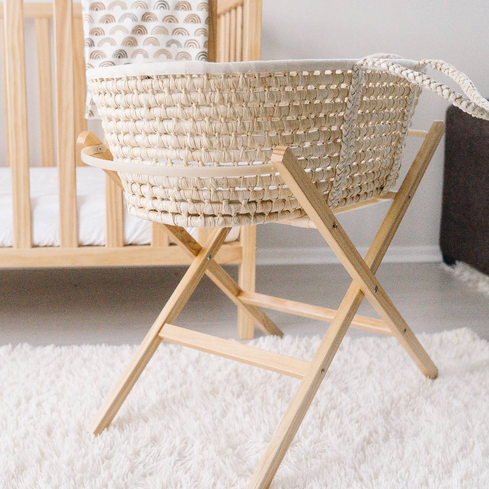 Moses Basket on a Folding Stand in a nursery setting. 