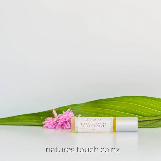 Natures Touch glass bottle against white background.