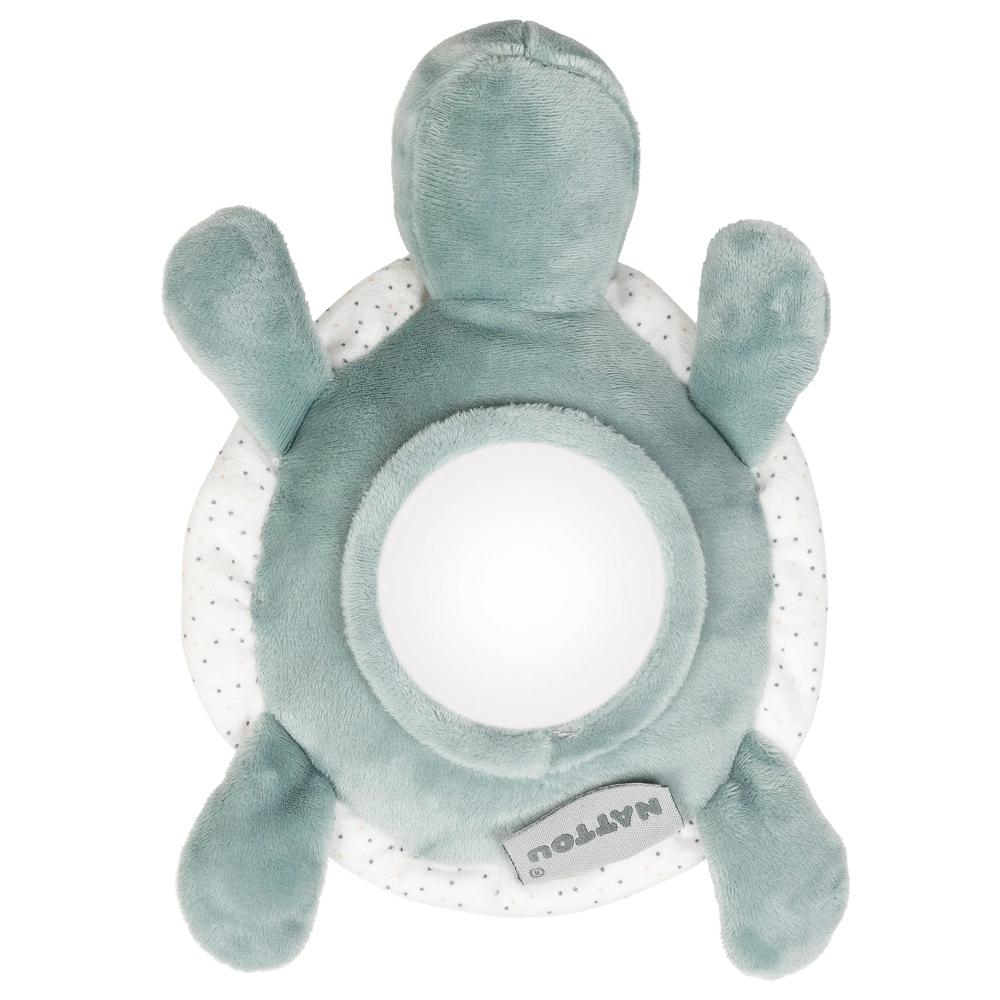 Plush turtle toy with a white ring on a white background